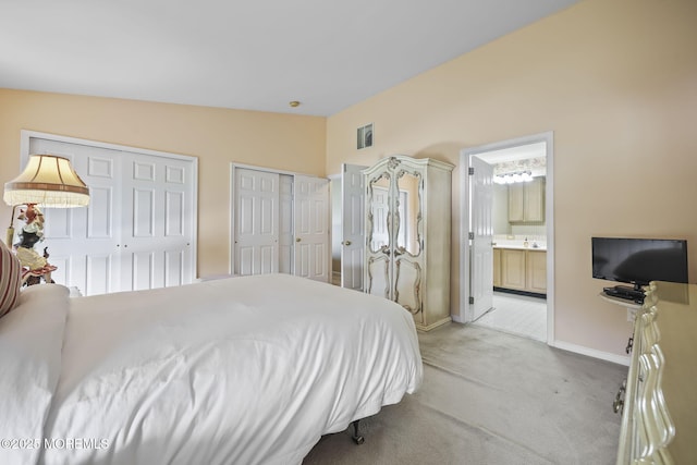 28 Brent Dr, Howell, NJ 07731 - bedroom with two closets, light carpet, lofted ceiling, and ensuite bath