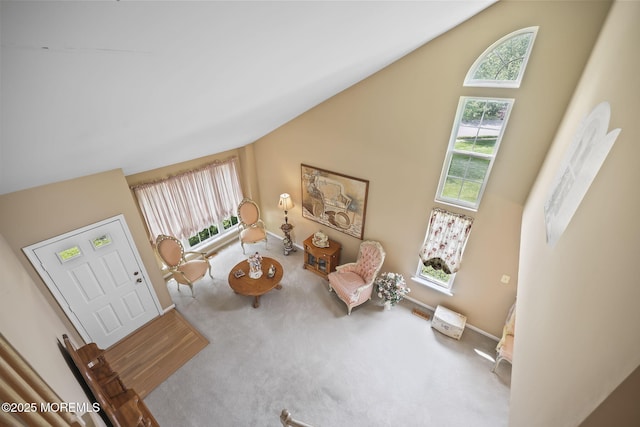 28 Brent Dr, Howell, NJ 07731 - carpeted living room with baseboards and high vaulted ceiling