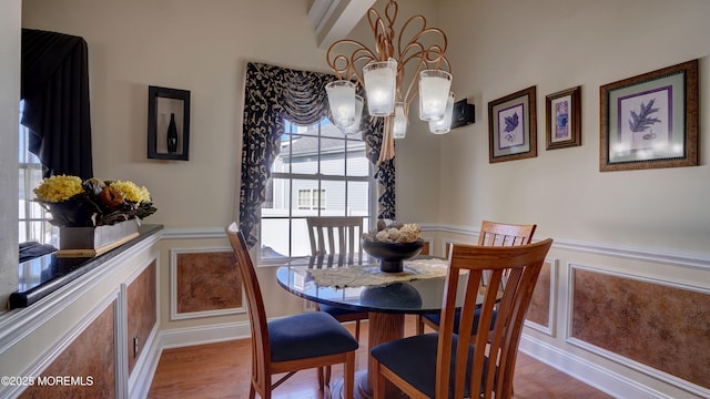 44 Kentucky Way, Freehold, NJ 07728 - dining space with wainscoting, wood finished floors, a chandelier, and beamed ceiling