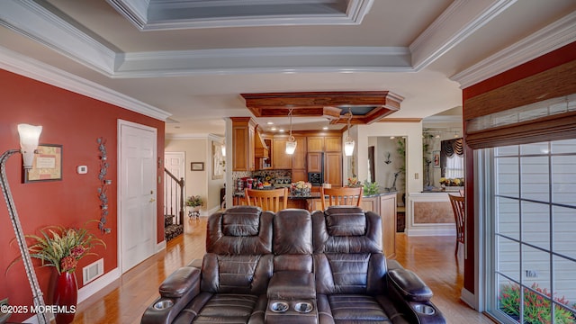 44 Kentucky Way, Freehold, NJ 07728 - living room featuring a tray ceiling, light wood-type flooring, stairway, and ornamental molding