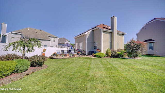 44 Kentucky Way, Freehold, NJ 07728 - back of house featuring a chimney and a patio area
