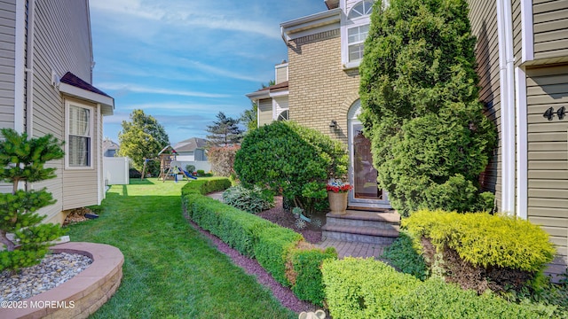 44 Kentucky Way, Freehold, NJ 07728 - view of grassy yard with a playground and a residential view