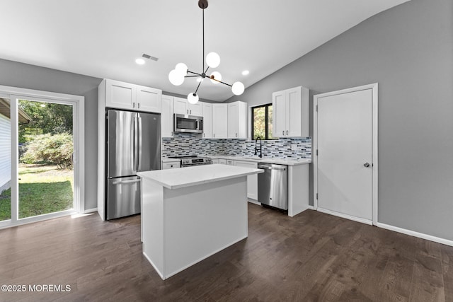 112 Beacon St, Moorestown, NJ 08057 - kitchen with appliances with stainless steel finishes, tasteful backsplash, a chandelier, light countertops, and lofted ceiling