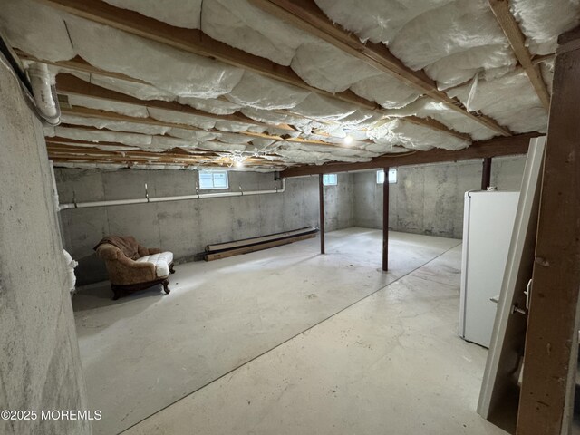 1464 Earie Way, Forked River, NJ 08731 - basement featuring a baseboard radiator and freestanding refrigerator