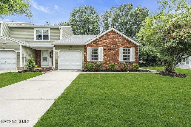 63 Oak Ln, Eatontown, NJ 07724 - traditional home with driveway, an attached garage, brick siding, and a front lawn