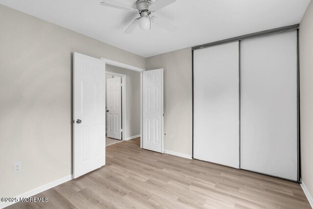 63 Oak Ln, Eatontown, NJ 07724 - unfurnished bedroom featuring light wood finished floors, a closet, and ceiling fan