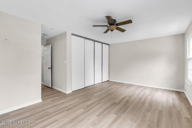 63 Oak Ln, Eatontown, NJ 07724 - unfurnished living room with a ceiling fan and light wood finished floors