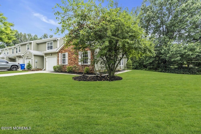 63 Oak Ln, Eatontown, NJ 07724 - view of front facade with concrete driveway, an attached garage, a front lawn, and brick siding