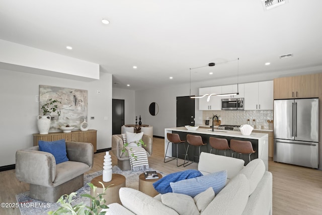 401 Boulevard 202, Seaside Heights, NJ 08751 - living room featuring light wood-type flooring and recessed lighting