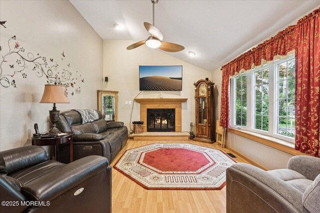 444 Cook Rd, Jackson, NJ 08527 - living room with ceiling fan, wood finished floors, lofted ceiling, and a glass covered fireplace