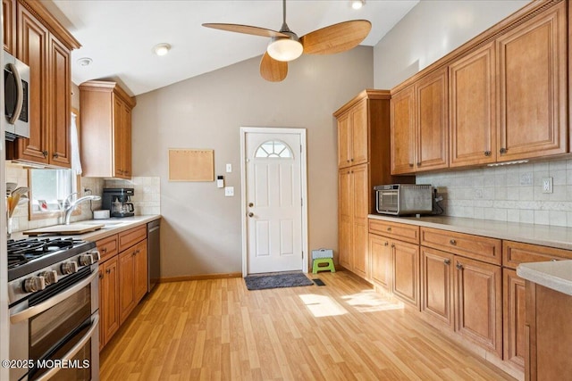 444 Cook Rd, Jackson, NJ 08527 - kitchen featuring appliances with stainless steel finishes, a ceiling fan, lofted ceiling, light countertops, and light wood-style floors