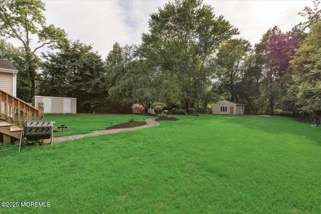 444 Cook Rd, Jackson, NJ 08527 - view of grassy yard featuring a storage shed and view of wooded area