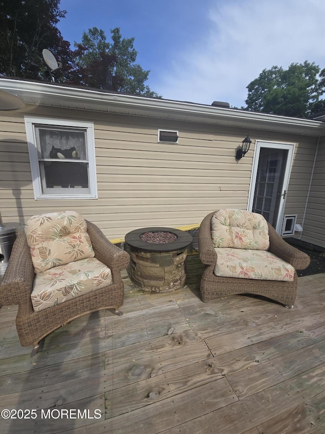 444 Cook Rd, Jackson, NJ 08527 - wooden terrace with an outdoor fire pit
