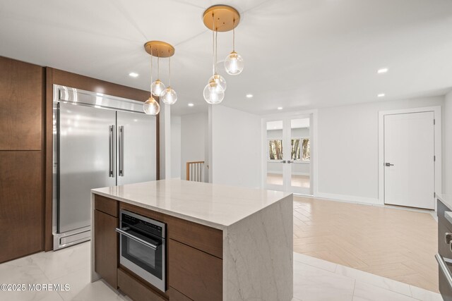 441 Slocum Pl, Oakhurst, NJ 07755 - kitchen with built in fridge, a kitchen island, recessed lighting, oven, and pendant lighting