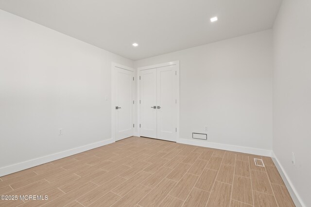 441 Slocum Pl, Oakhurst, NJ 07755 - unfurnished bedroom featuring light wood finished floors and recessed lighting