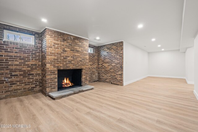 441 Slocum Pl, Oakhurst, NJ 07755 - unfurnished living room with brick wall, wood finished floors, a brick fireplace, plenty of natural light, and recessed lighting