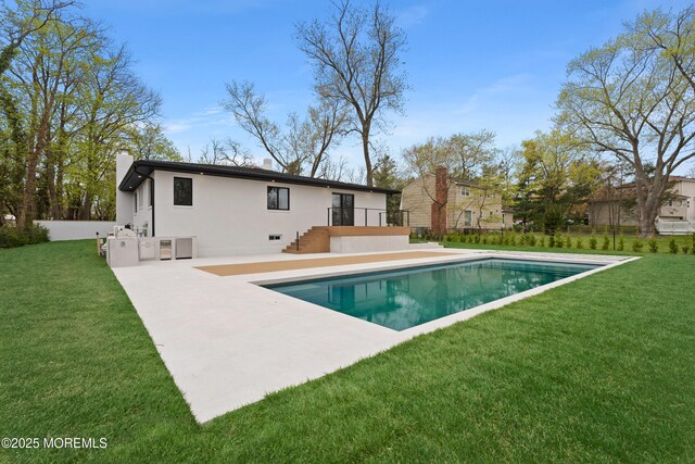 441 Slocum Pl, Oakhurst, NJ 07755 - rear view of property with a patio, an outdoor pool, a lawn, and a chimney