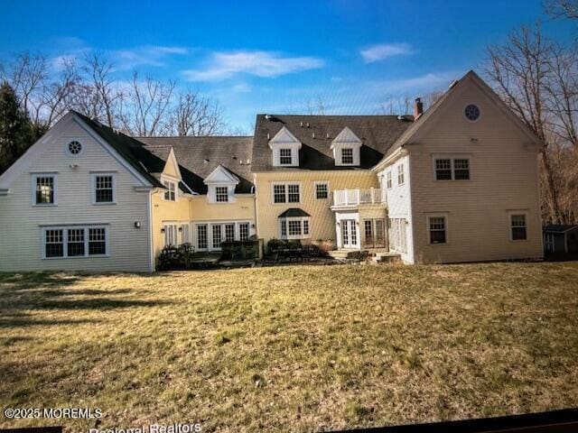 41 Marlpit Pl, Middletown, NJ 07748 - rear view of house featuring french doors, a yard, a balcony, and a chimney
