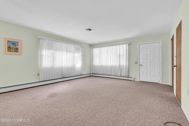 46 Carmacks Way, Toms River, NJ 08757 - carpeted empty room with plenty of natural light and baseboard heating