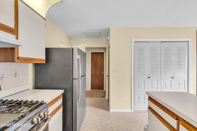 46 Carmacks Way, Toms River, NJ 08757 - kitchen with light countertops, gas stove, backsplash, and light colored carpet