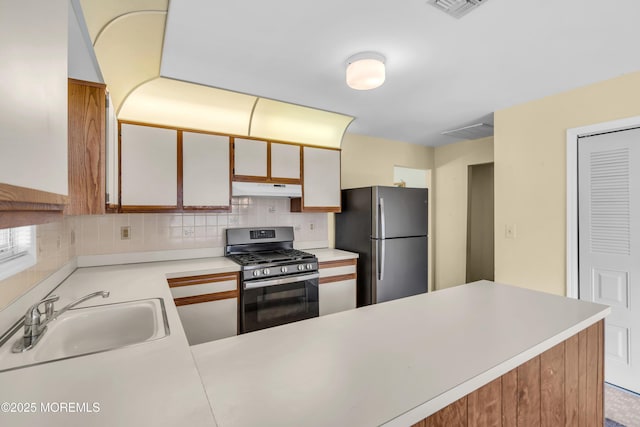 46 Carmacks Way, Toms River, NJ 08757 - kitchen with appliances with stainless steel finishes, under cabinet range hood, light countertops, and backsplash
