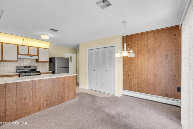 46 Carmacks Way, Toms River, NJ 08757 - kitchen with stainless steel appliances, a baseboard heating unit, under cabinet range hood, decorative backsplash, and carpet