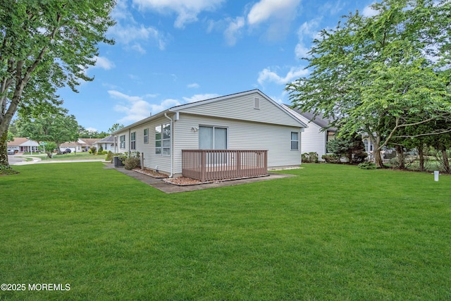 46 Carmacks Way, Toms River, NJ 08757 - back of house featuring a lawn and a deck