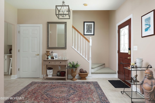 8001/2 Schoolhouse Rd, Brielle, NJ 08730 - entrance foyer with stairway, light tile patterned floors, and a chandelier