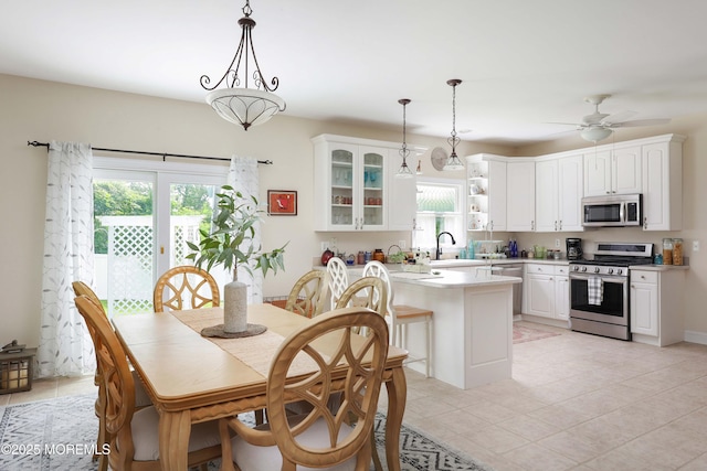 8001/2 Schoolhouse Rd, Brielle, NJ 08730 - dining area with light tile patterned flooring and a ceiling fan