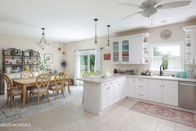 8001/2 Schoolhouse Rd, Brielle, NJ 08730 - kitchen featuring stainless steel dishwasher, a peninsula, open shelves, light countertops, and decorative light fixtures