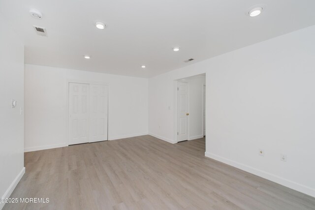402 Hidden Village Dr Unit 402, Perth Amboy, NJ 08862 - empty room with light wood finished floors, a smoke detector, and recessed lighting