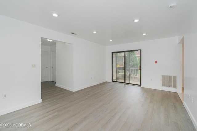 402 Hidden Village Dr Unit 402, Perth Amboy, NJ 08862 - unfurnished room with light wood finished floors, a smoke detector, and recessed lighting