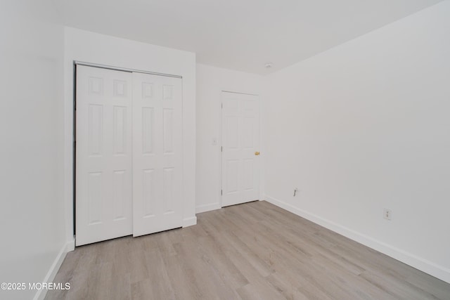 402 Hidden Village Dr Unit 402, Perth Amboy, NJ 08862 - unfurnished bedroom with light wood-style flooring and a closet