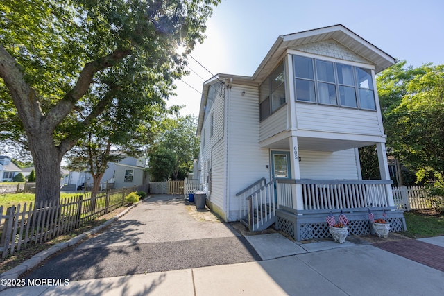 605 Ocean Gate Ave, Ocean Gate, NJ 08740 - view of front of property with asphalt driveway and covered porch
