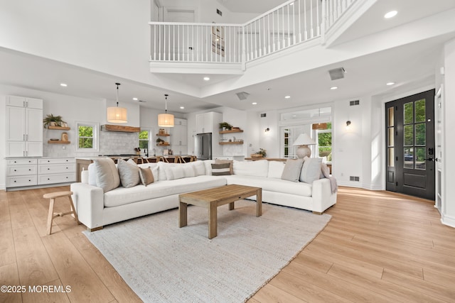 199-203 Lake Ave, Island Heights, NJ 08732 - living room with light wood-style floors, a towering ceiling, and recessed lighting