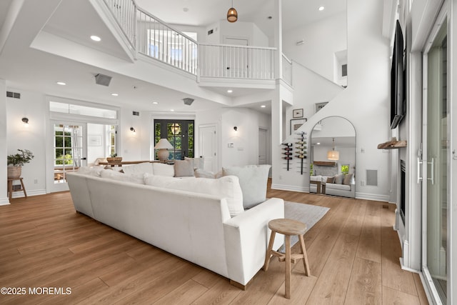 199-203 Lake Ave, Island Heights, NJ 08732 - living area featuring light wood-type flooring, a towering ceiling, and recessed lighting