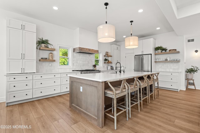 199-203 Lake Ave, Island Heights, NJ 08732 - kitchen featuring open shelves, light wood-style floors, light countertops, tasteful backsplash, and recessed lighting