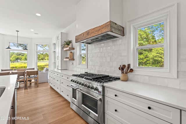 199-203 Lake Ave, Island Heights, NJ 08732 - kitchen with range with two ovens, premium range hood, white cabinetry, backsplash, and recessed lighting