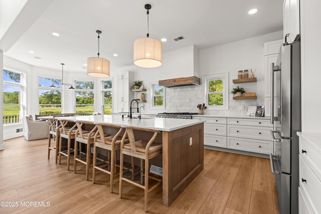 199-203 Lake Ave, Island Heights, NJ 08732 - kitchen with open shelves, tasteful backsplash, light countertops, freestanding refrigerator, and recessed lighting