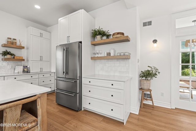199-203 Lake Ave, Island Heights, NJ 08732 - kitchen featuring high end fridge, open shelves, light wood-style floors, light countertops, and recessed lighting