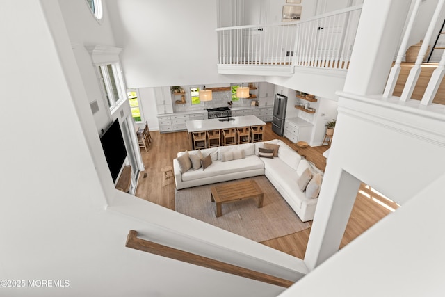 199-203 Lake Ave, Island Heights, NJ 08732 - living room with a high ceiling, wood finished floors, and a fireplace