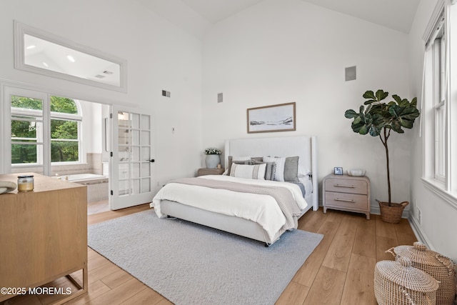 199-203 Lake Ave, Island Heights, NJ 08732 - bedroom featuring high vaulted ceiling, multiple windows, and light wood-type flooring