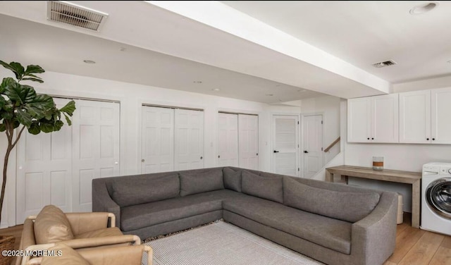 199-203 Lake Ave, Island Heights, NJ 08732 - living area with washer / clothes dryer and light wood finished floors