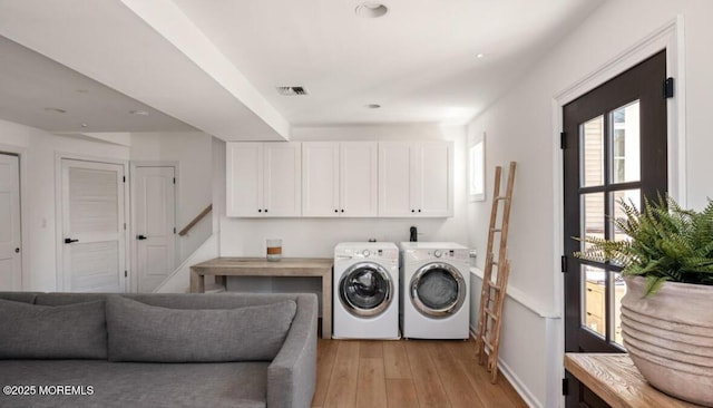 199-203 Lake Ave, Island Heights, NJ 08732 - laundry room with independent washer and dryer, cabinet space, light wood finished floors, and recessed lighting