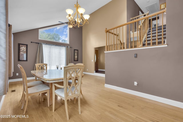 993 Sandy Cir, Manahawkin, NJ 08050 - dining room featuring light wood-type flooring, a chandelier, high vaulted ceiling, and stairway