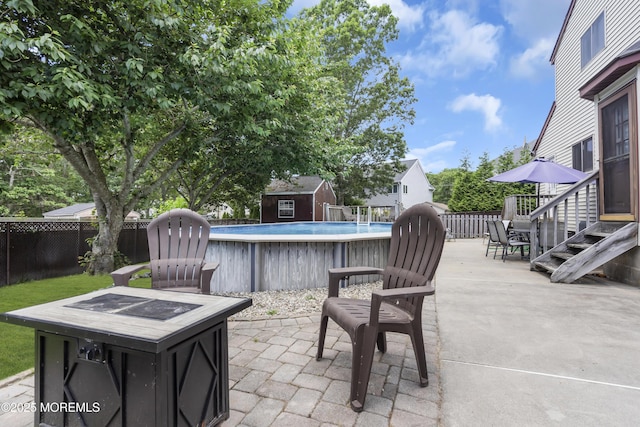 993 Sandy Cir, Manahawkin, NJ 08050 - view of patio / terrace with a storage unit and an outdoor fire pit