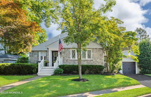 79 Lake Shore Dr, Red Bank, NJ 07701 - view of front of house featuring stone siding, a front lawn, a garage, and driveway