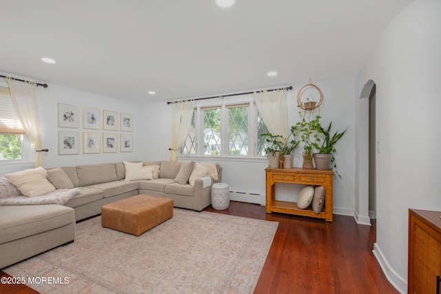 79 Lake Shore Dr, Red Bank, NJ 07701 - living room featuring baseboard heating, arched walkways, healthy amount of natural light, dark wood finished floors, and recessed lighting