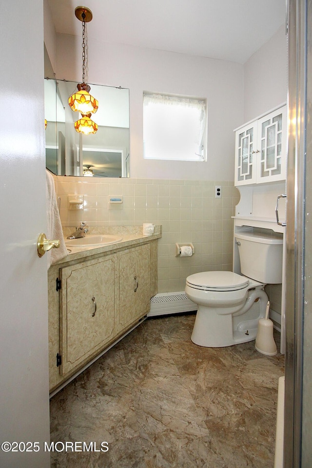 288 Barbados Dr N, Toms River, NJ 08757 - bathroom featuring vanity, a baseboard heating unit, and tile walls