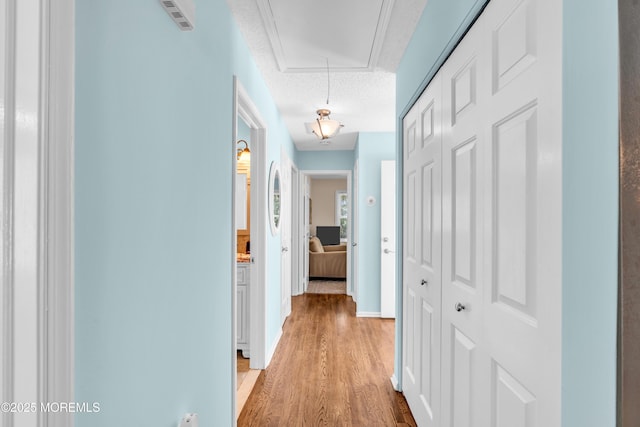 82 Spinnaker Ct, Bayville, NJ 08721 - corridor with attic access, light wood-style floors, and a textured ceiling